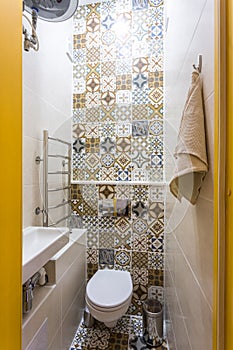 Toilet and detail of a corner shower cabin with wall mount shower attachment Ã¯Â¿Â½Ã¯Â¿Â½ bathroom of hotel